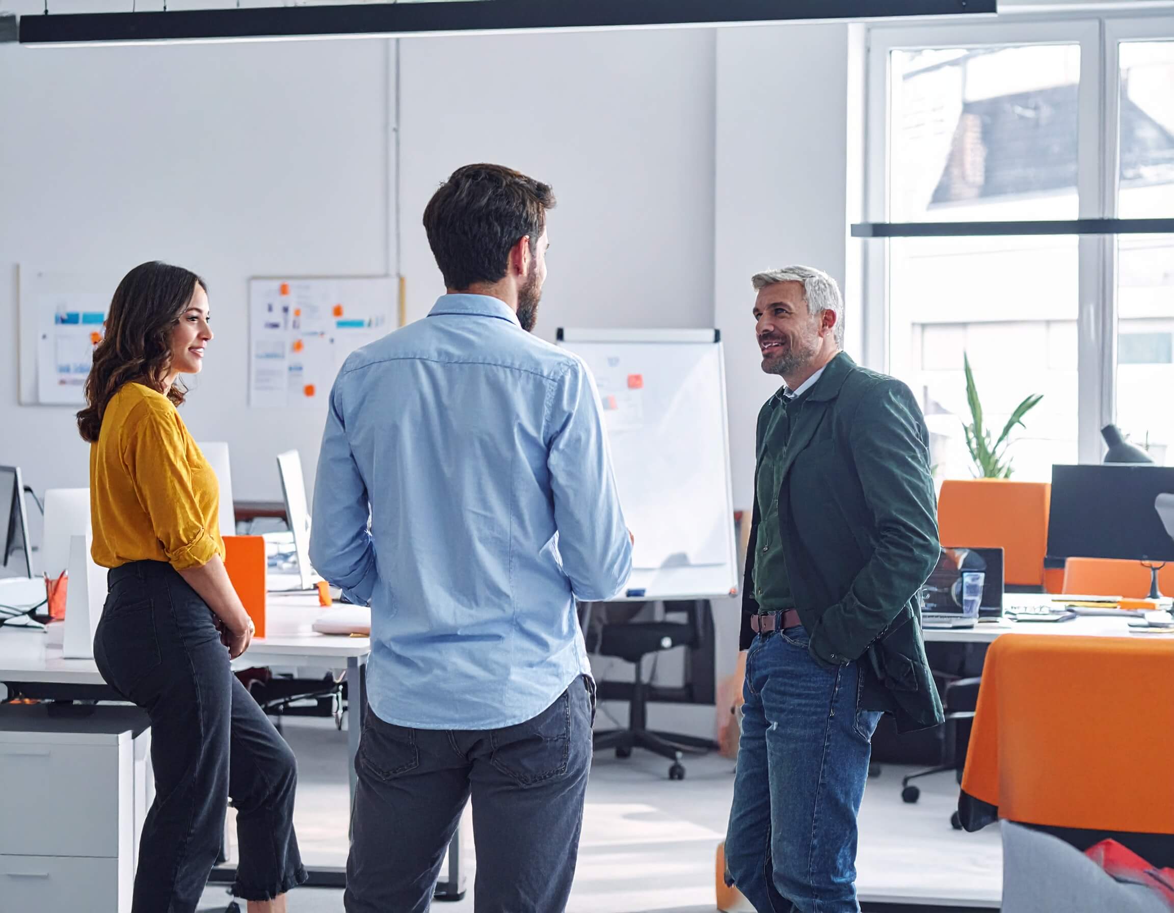 Ecommerce experts talking to a client in the Ecommerce Smart office